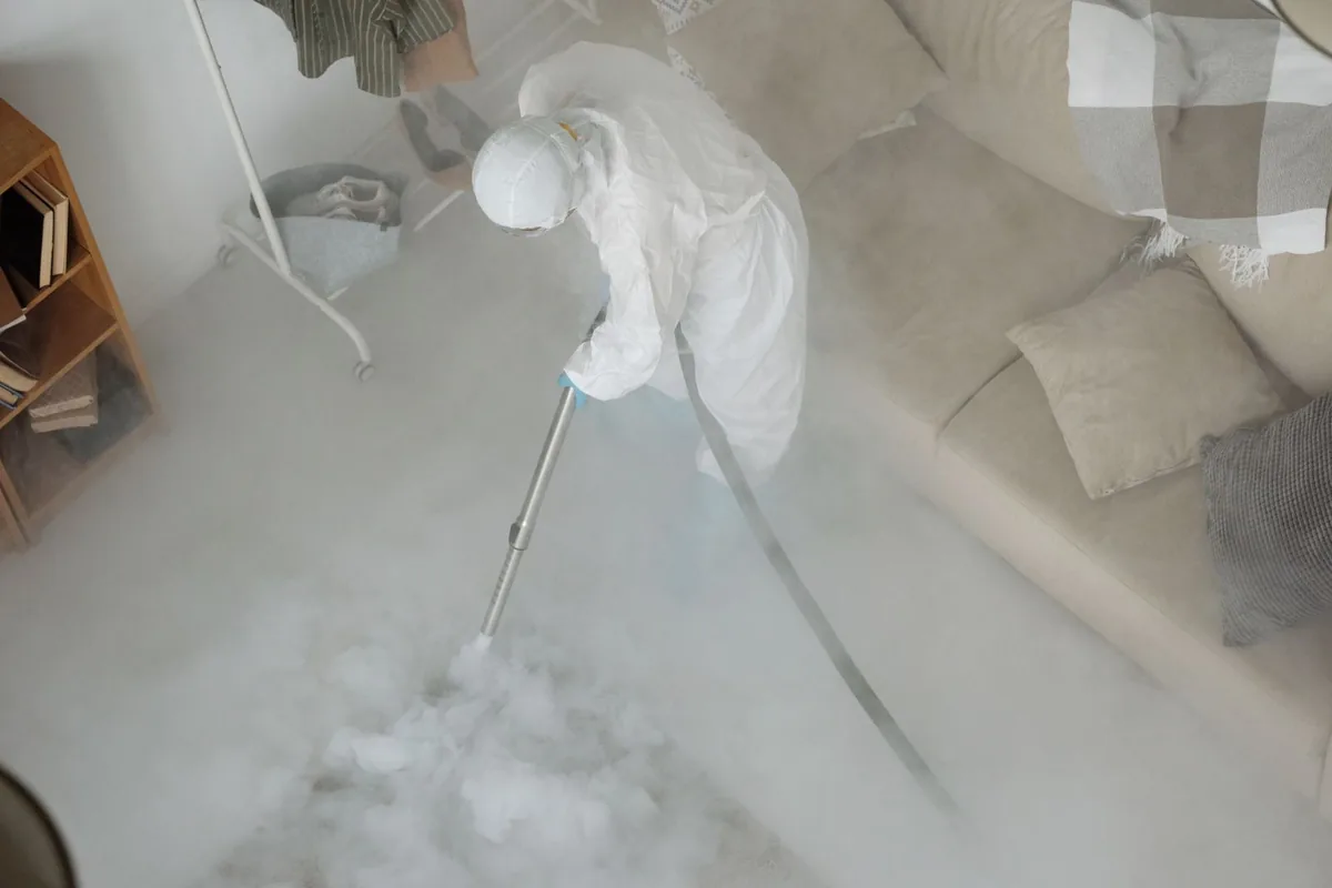 Biohazard cleanup technician in protective equipment, Loretto, TN